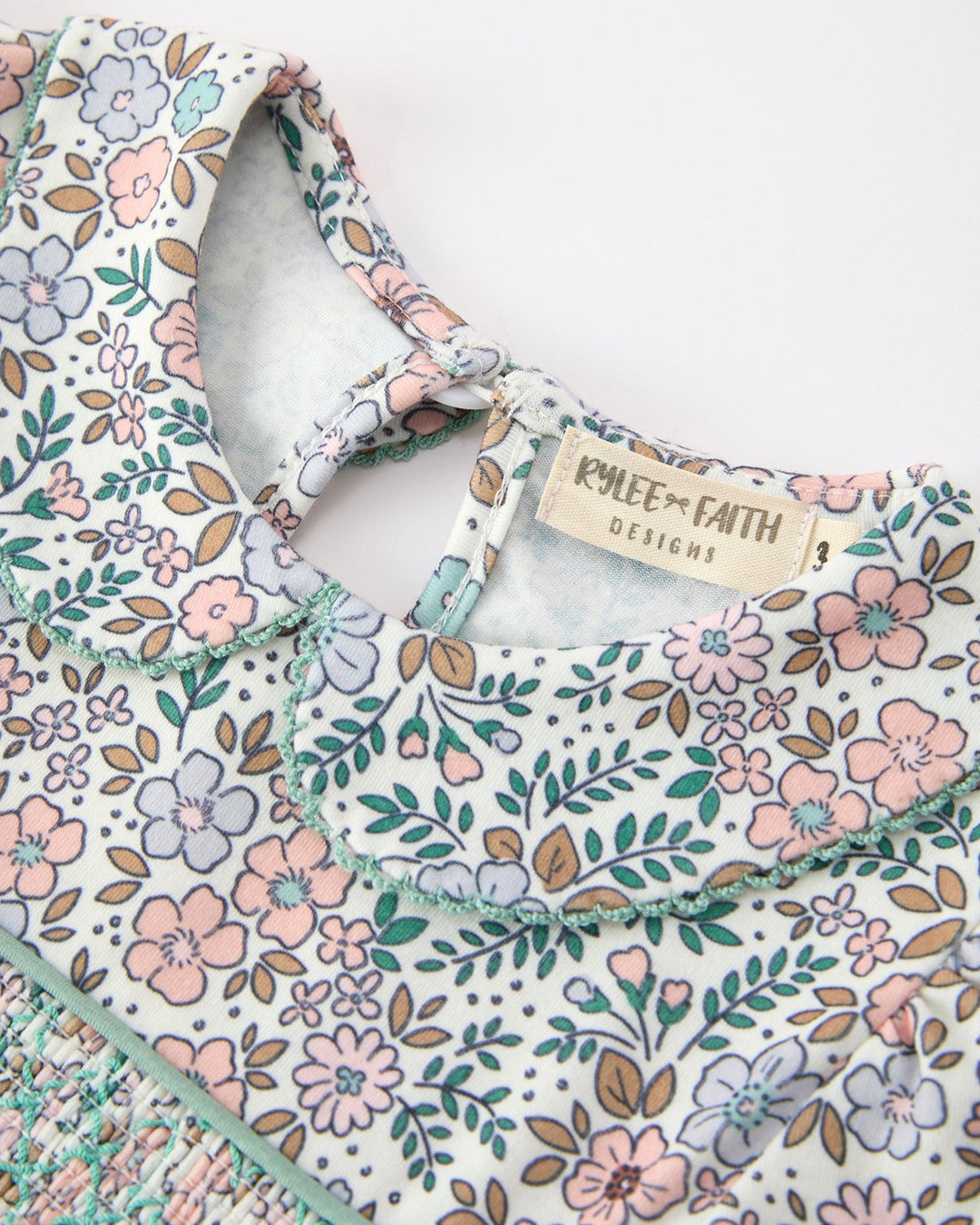 Floral girls dress with sage ribbon bow and &
