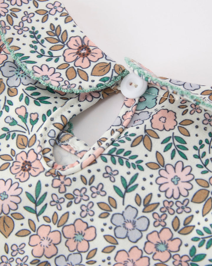 Girls floral dress neckline with button placket and sage trim
