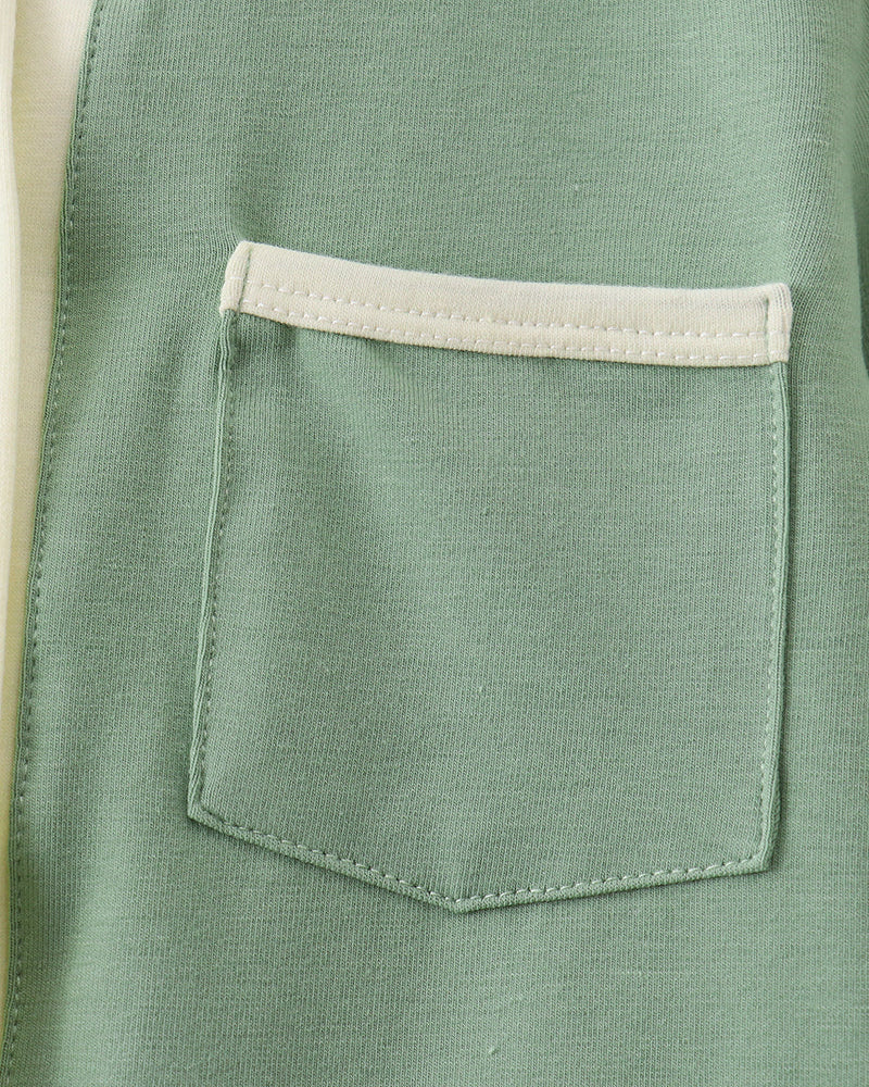 Sage green button-down shirt with chest pocket and cream trim.