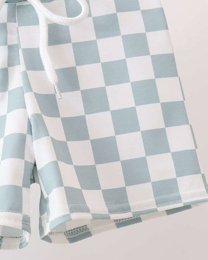 Checkered fabric with blue and white pattern on a light gray background
