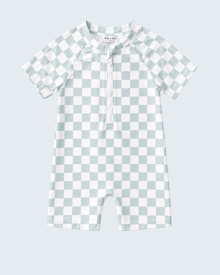 Checkered swimsuit on a light blue background