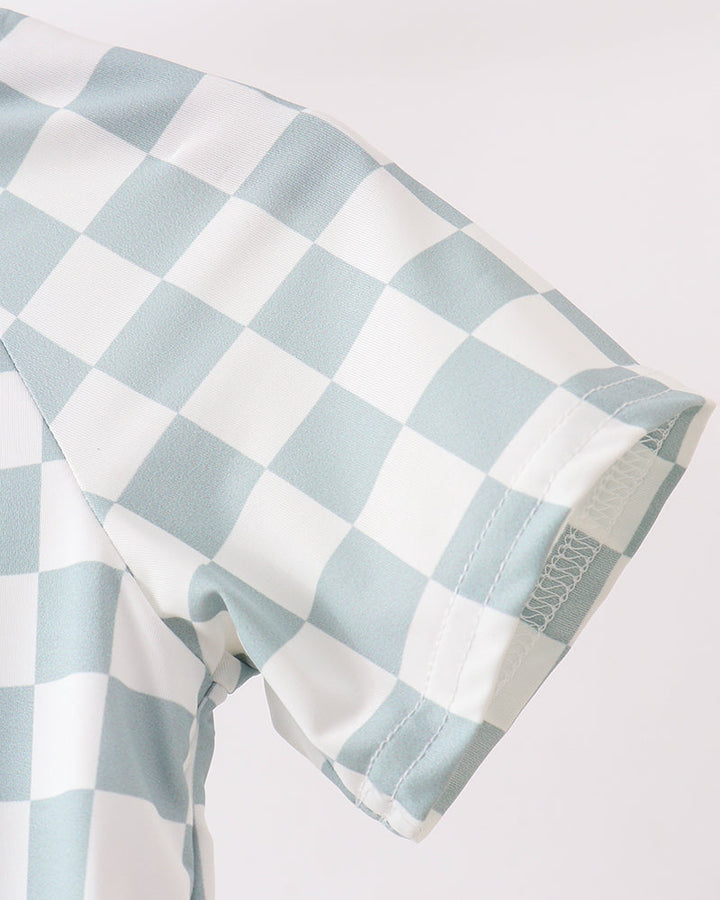 Checkered fabric with light blue and white pattern on a white background