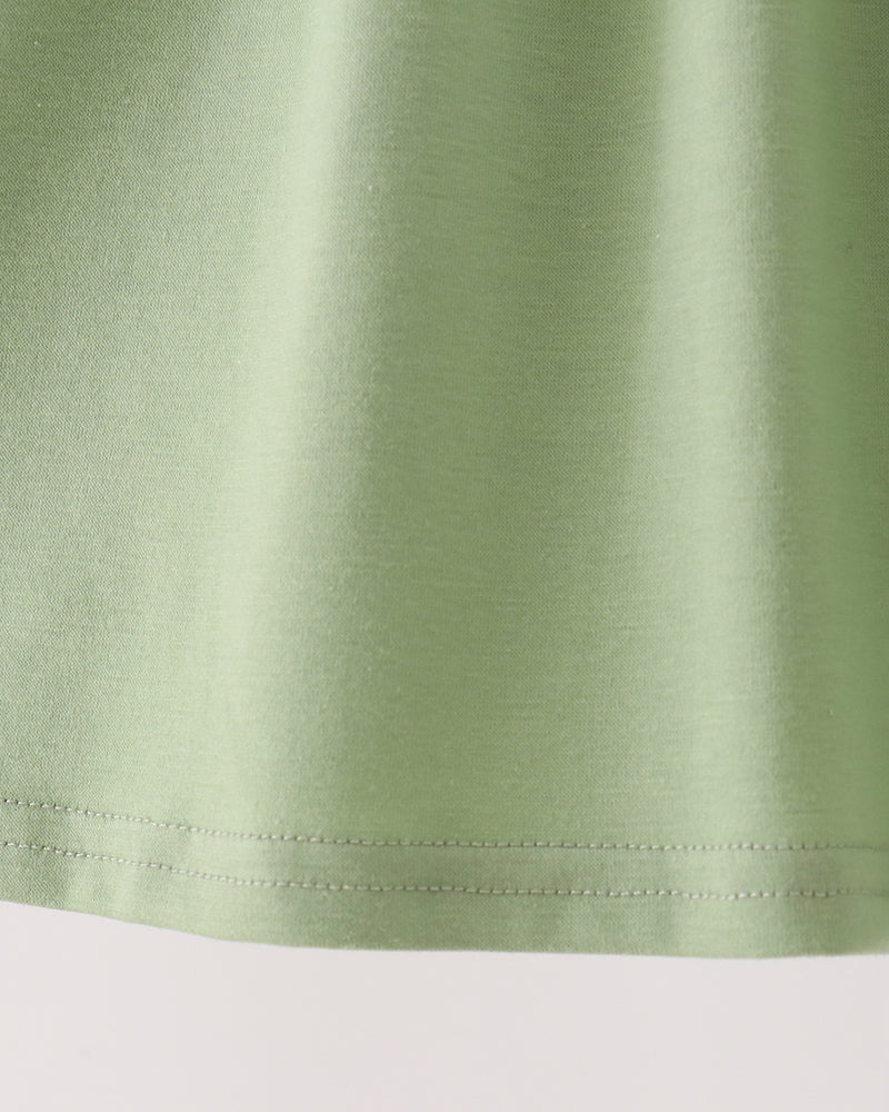 Sage green long-sleeve dress with embroidered deer faces and ruffle hem