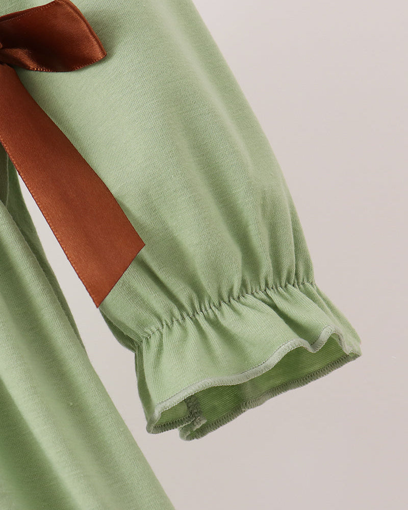 Sage green long sleeve with brown ribbon trim and elastic cuff