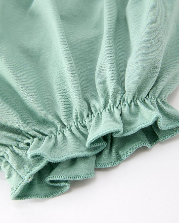 Sage green bloomer shorts with elastic waist and ruffled leg hem