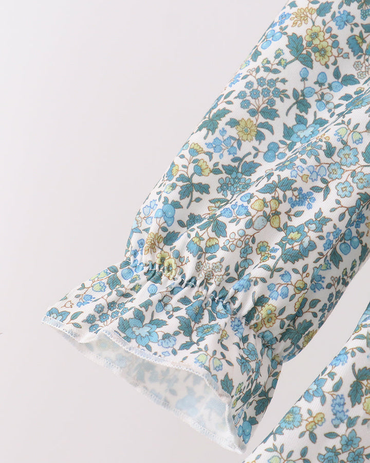 Floral long-sleeve top with smocked neckline and gathered elastic cuff detail