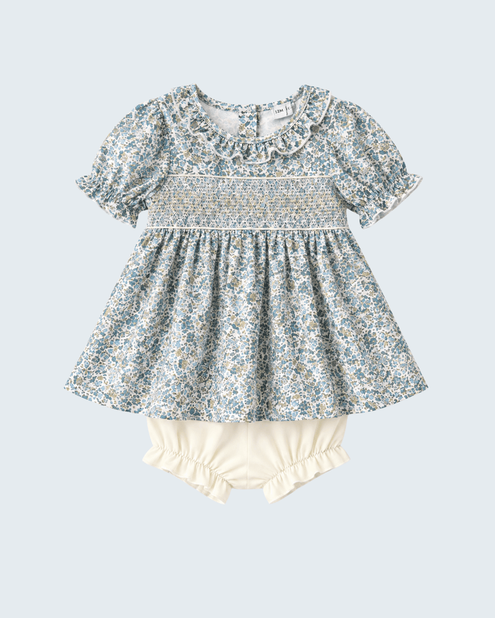 Floral ruffle baby dress with matching light yellow bloomer shorts, flat lay