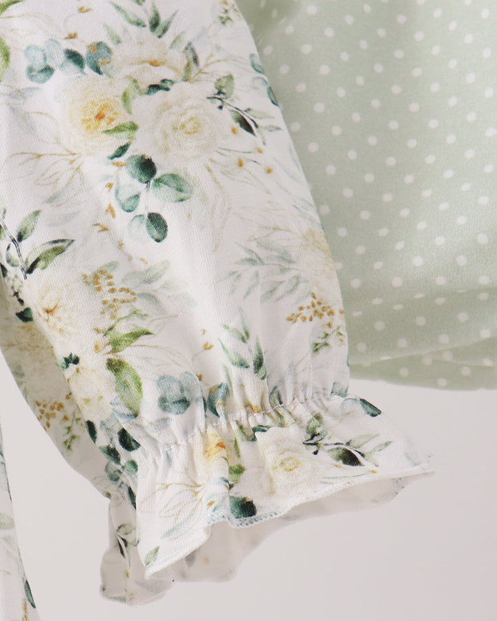 Floral long-sleeve ruffle top with elastic cuff and gathered hem, sage green accents