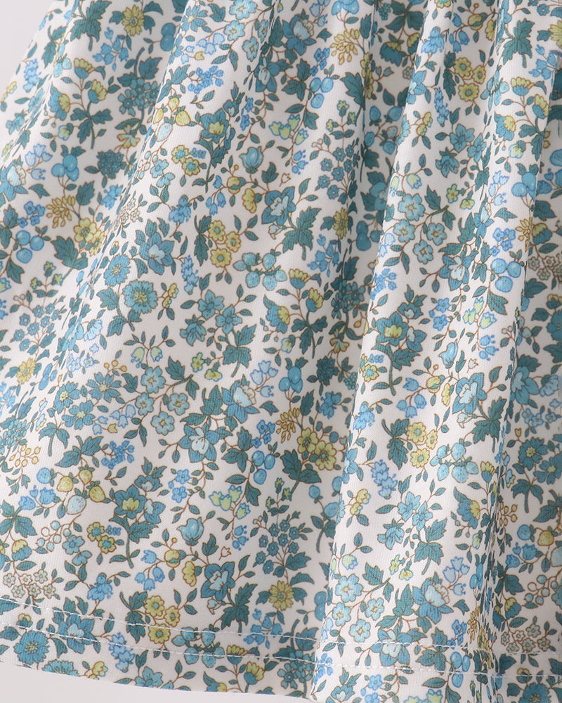 Light blue floral fabric with small green and yellow flower prints