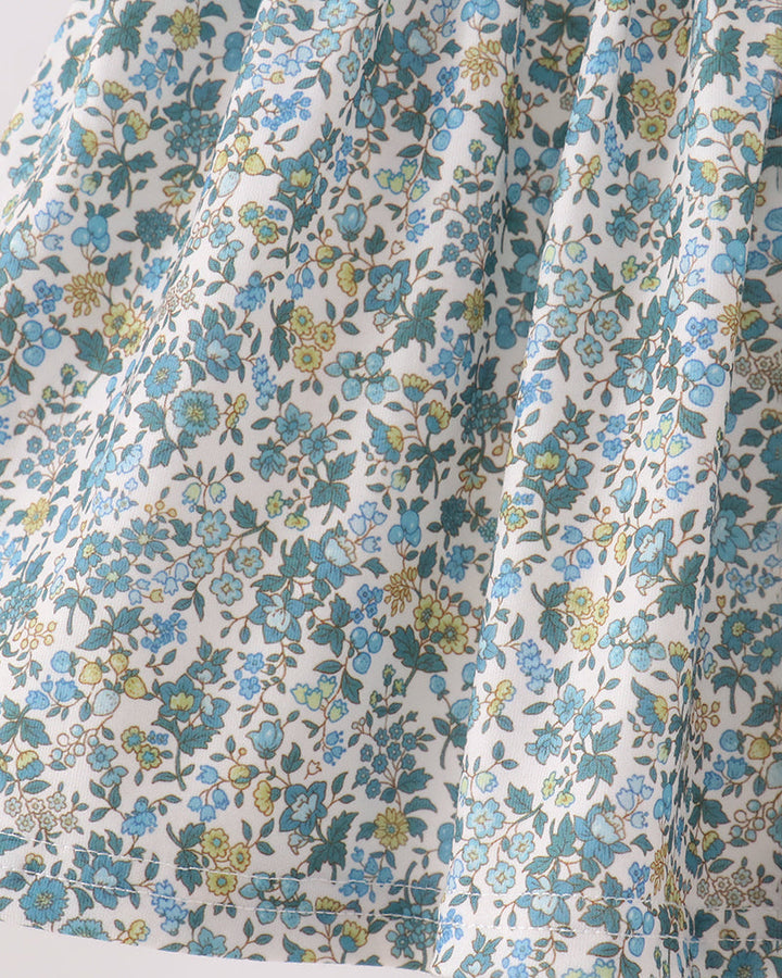 Light blue floral fabric with small green and yellow flower prints