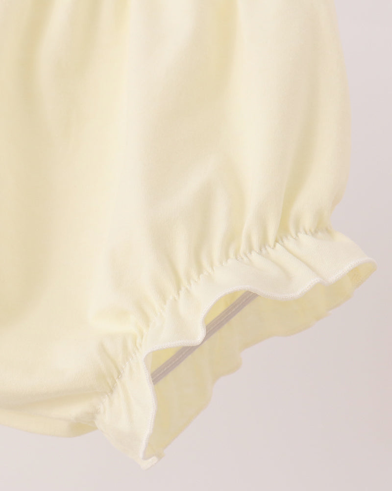 Light yellow baby bloomer shorts with ruffled hem