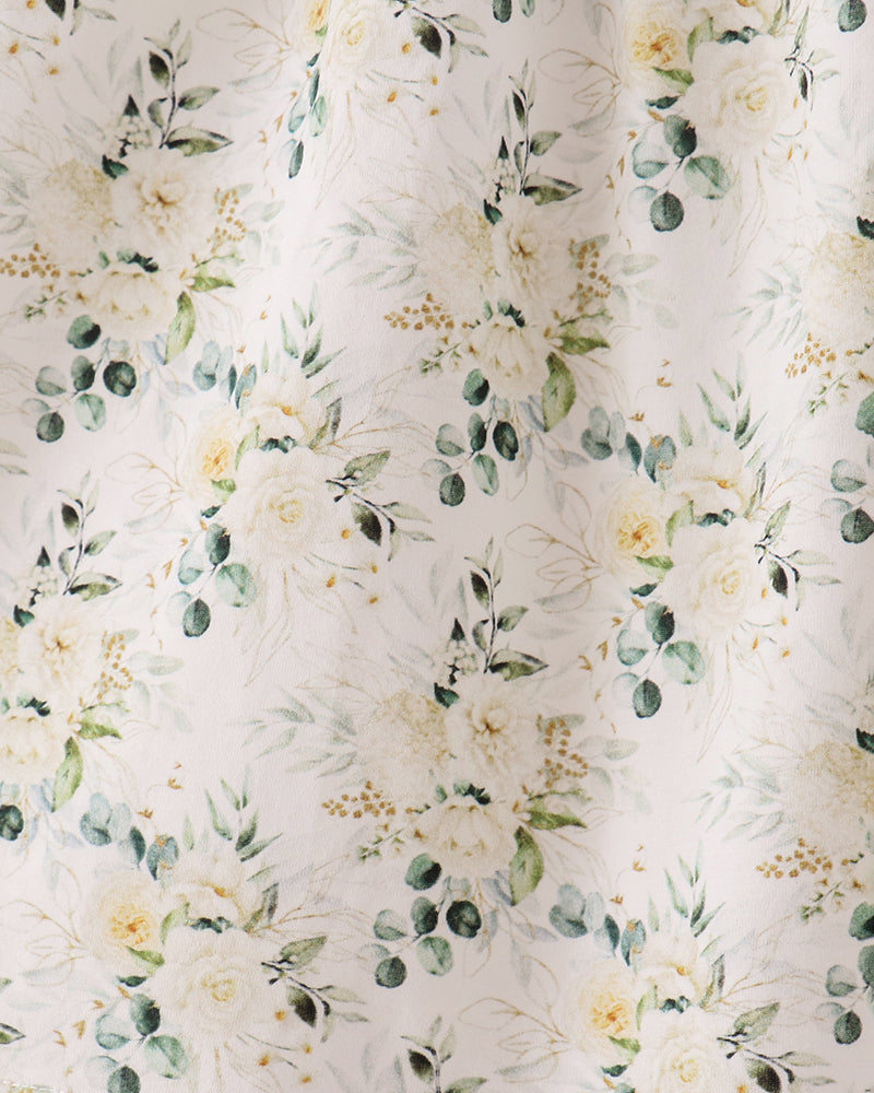 Light cream floral fabric with sage green leaves and small yellow flower pattern