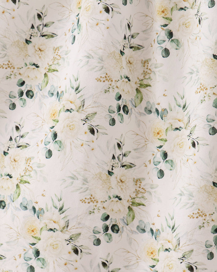 Light cream floral fabric with sage green leaves and small yellow flower pattern
