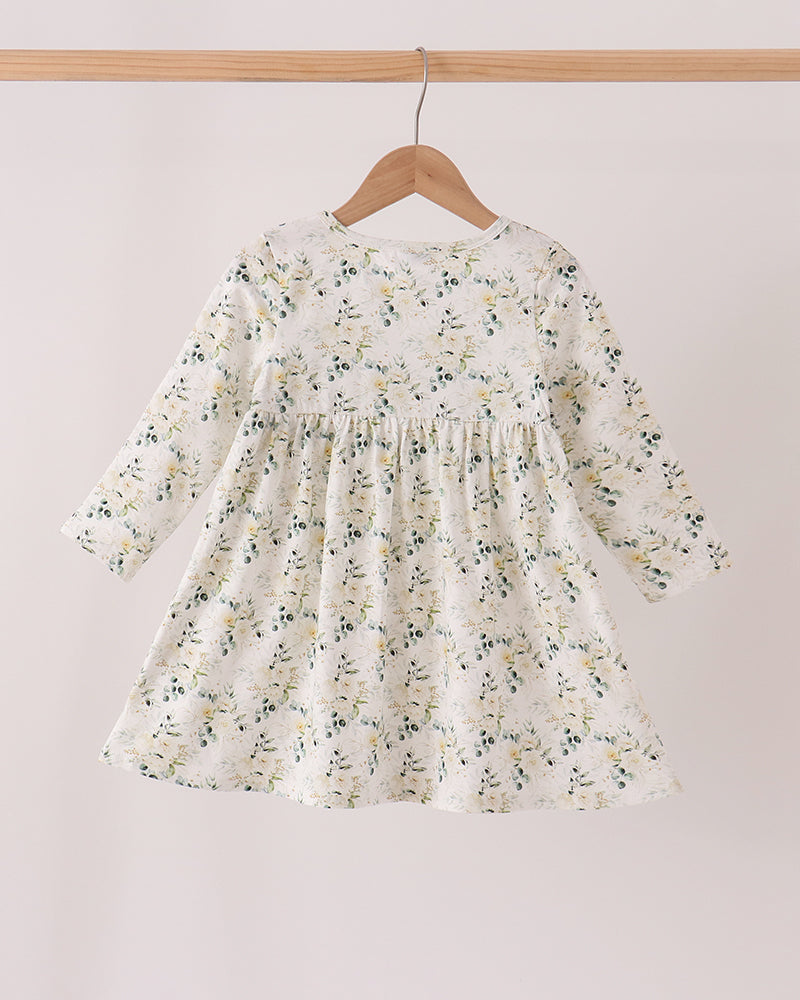 Floral long-sleeve dress with smocked yoke and gathered skirt on hanger