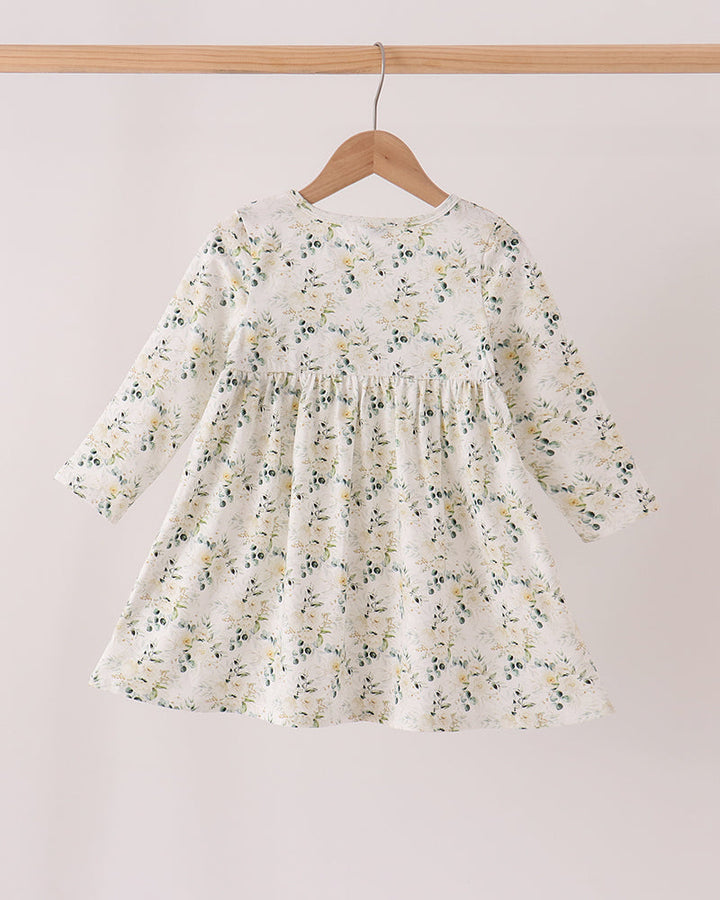 Floral long-sleeve dress with smocked yoke and gathered skirt on hanger