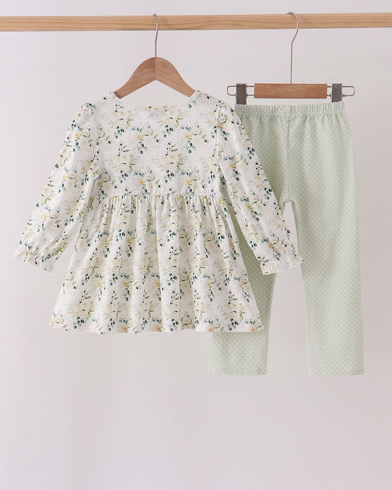 Kids outfit on hangers: white floral ruffle top with sage dotted pants