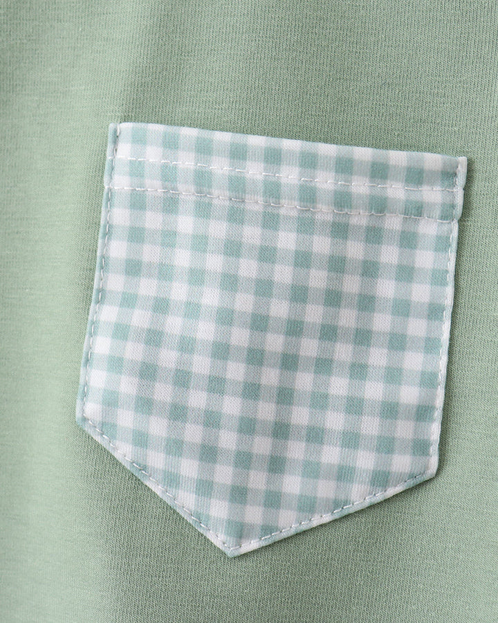 Green shirt with a checkered pocket