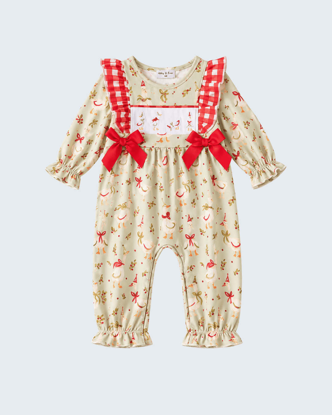 Cream long-sleeve romper with red check ruffles and big bow accents at chest