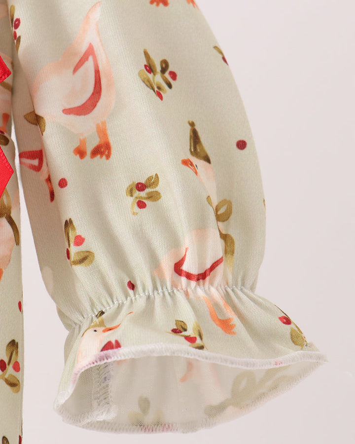 Cream romper with gathered ankle hem and allover animal print, elastic waist