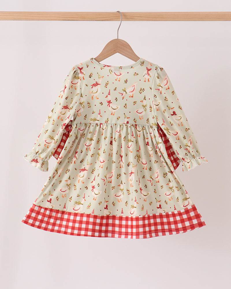Cream long-sleeve dress with embroidered animal print, gathered skirt, and red gingham hem