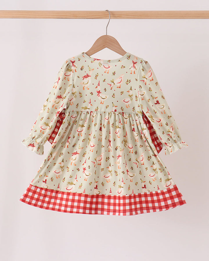 Cream long-sleeve dress with embroidered animal print, gathered skirt, and red gingham hem