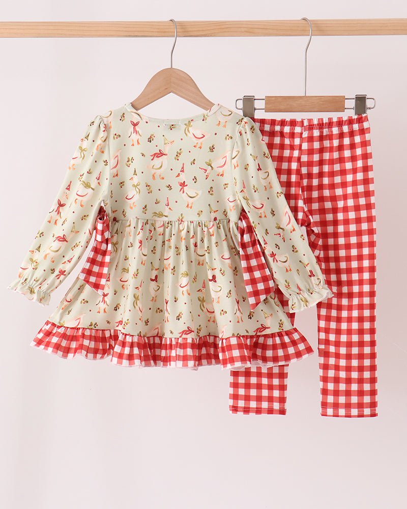 Kids printed ruffle top and red gingham pants set hanging together