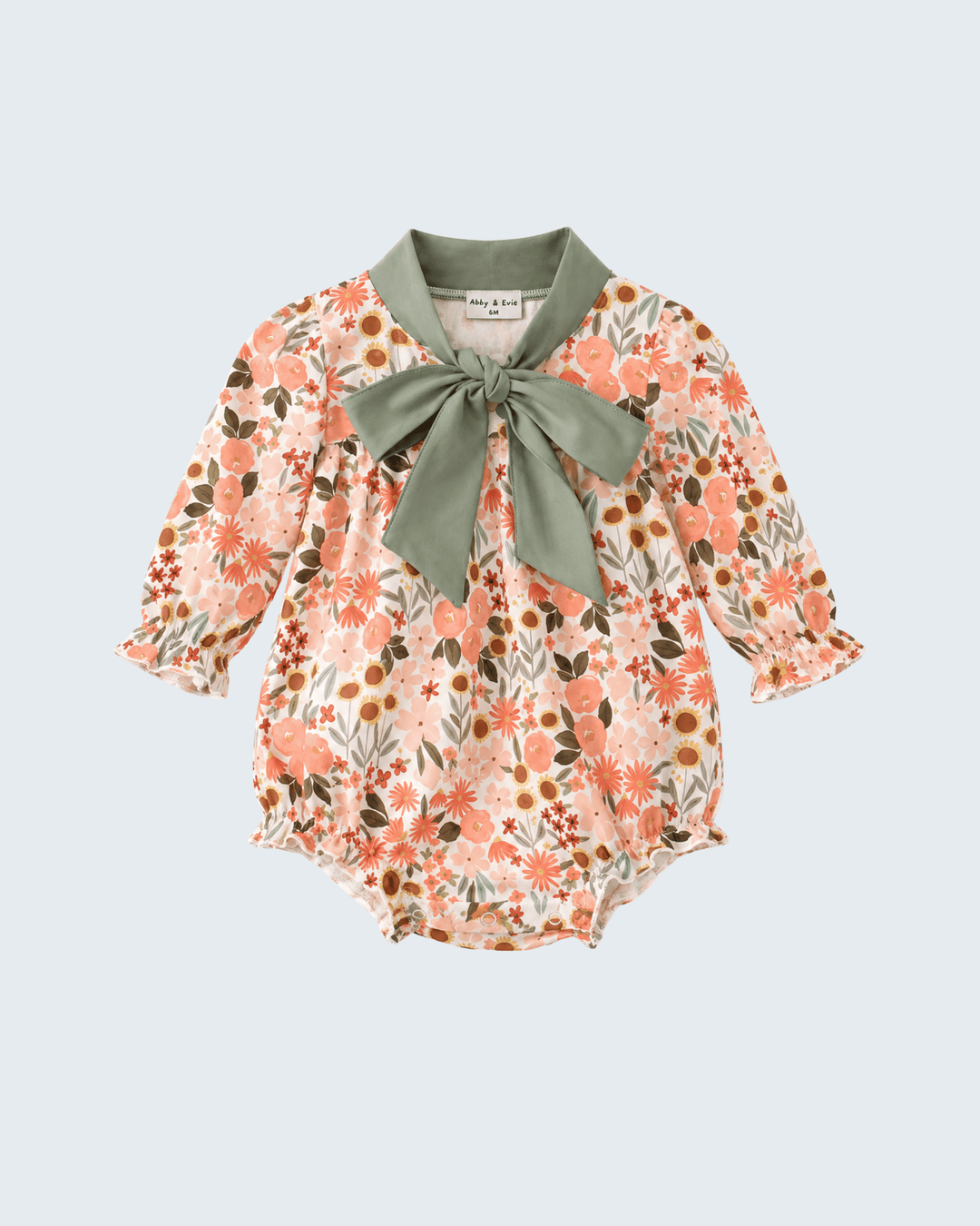 Floral bubble romper with sage green bow at neckline, long sleeves