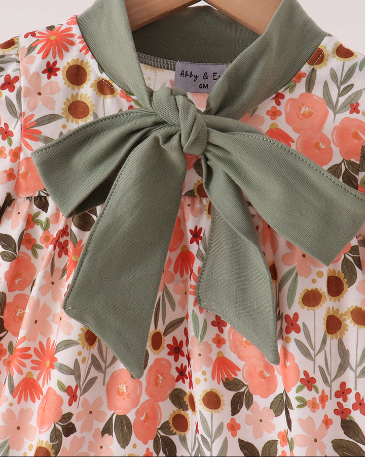 Floral bubble dress with large olive green bow detail and long sleeves