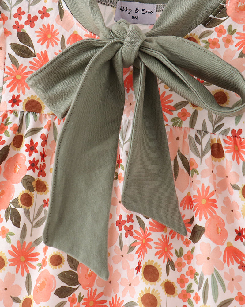Floral baby dress bodice with green tie neck bow