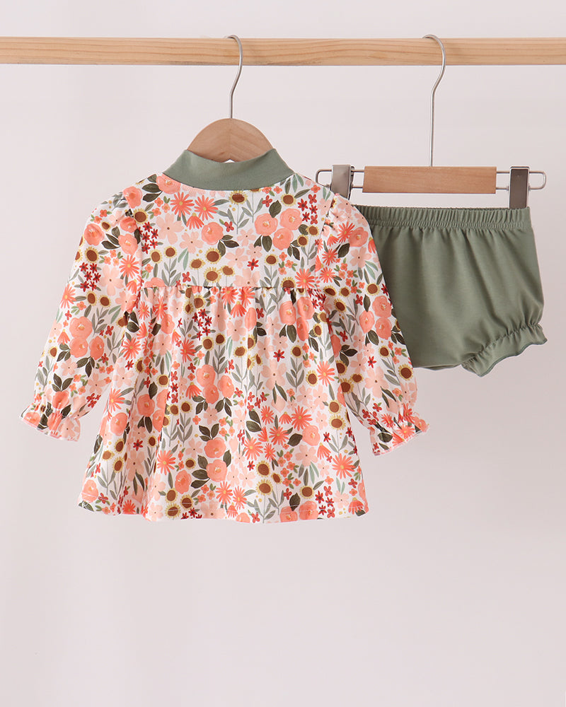 Floral baby dress with green tie neck and matching green bloomer shorts