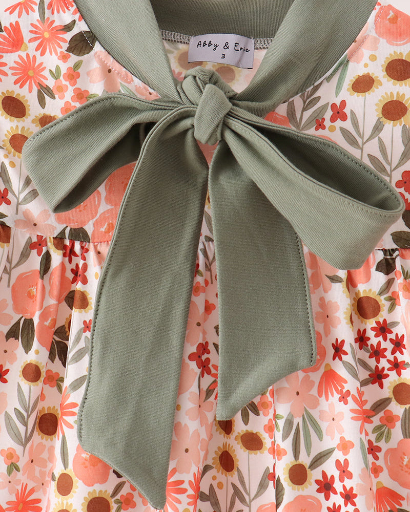 Floral dress top with large sage green bow at neckline