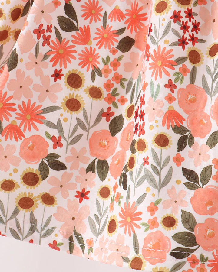 Floral print long-sleeve top fabric in pink, orange, and green