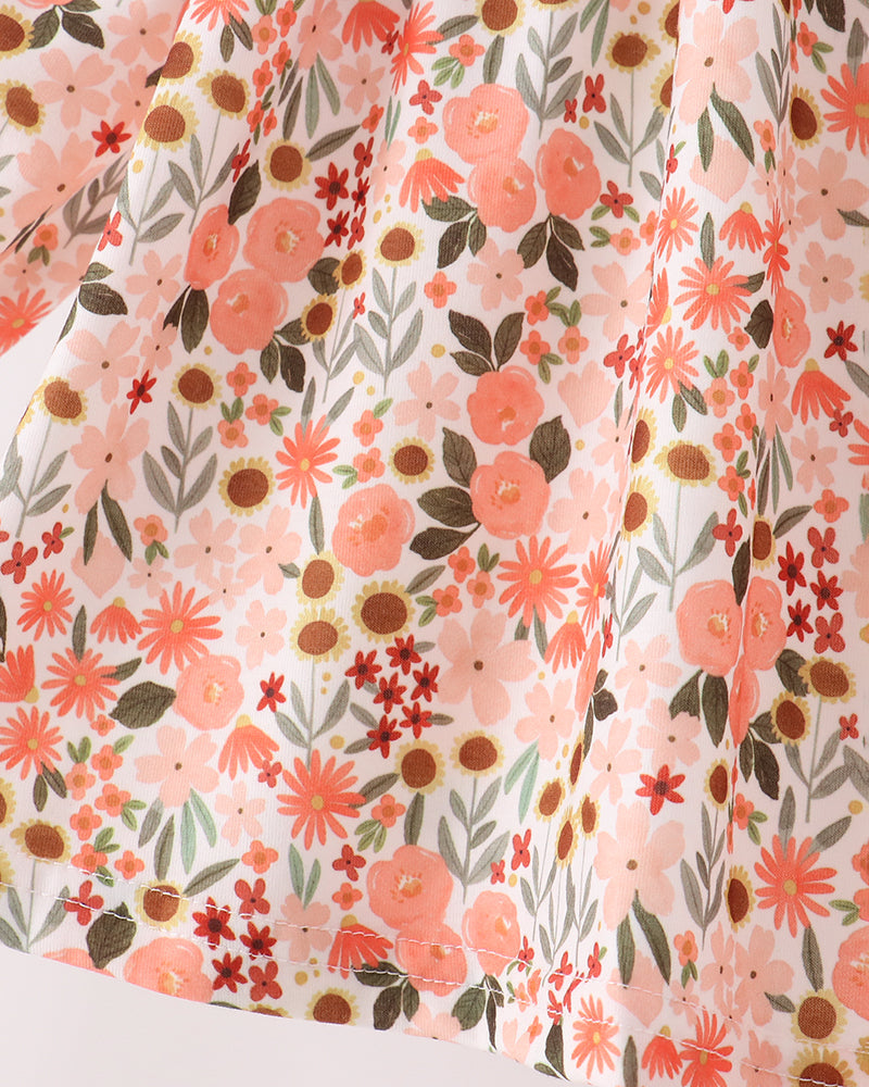 Floral print fabric with pink, orange, and brown flowers