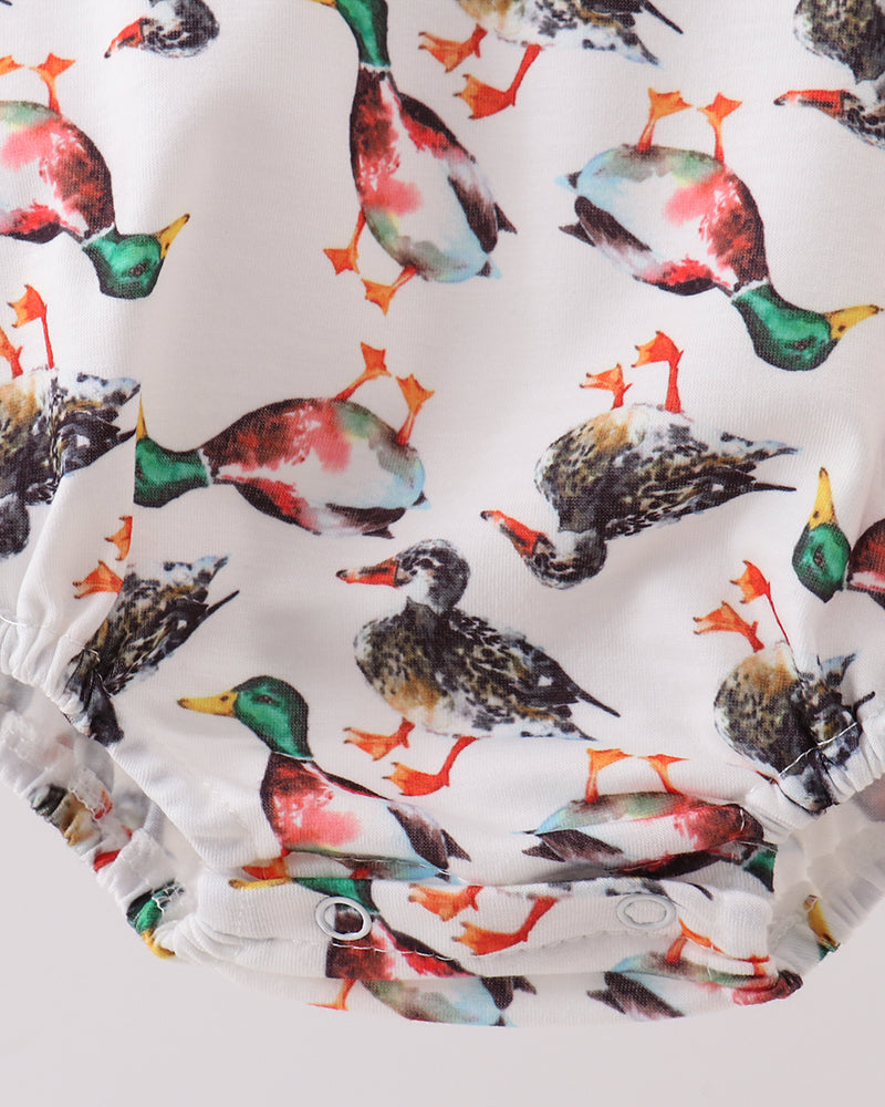 White bubble romper with gathered hem and multicolor bird print