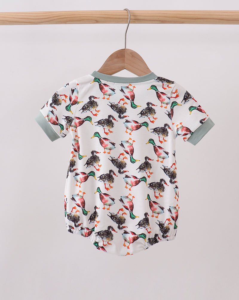 White baby bubble romper with colorful bird pattern, sage collar and short sleeves