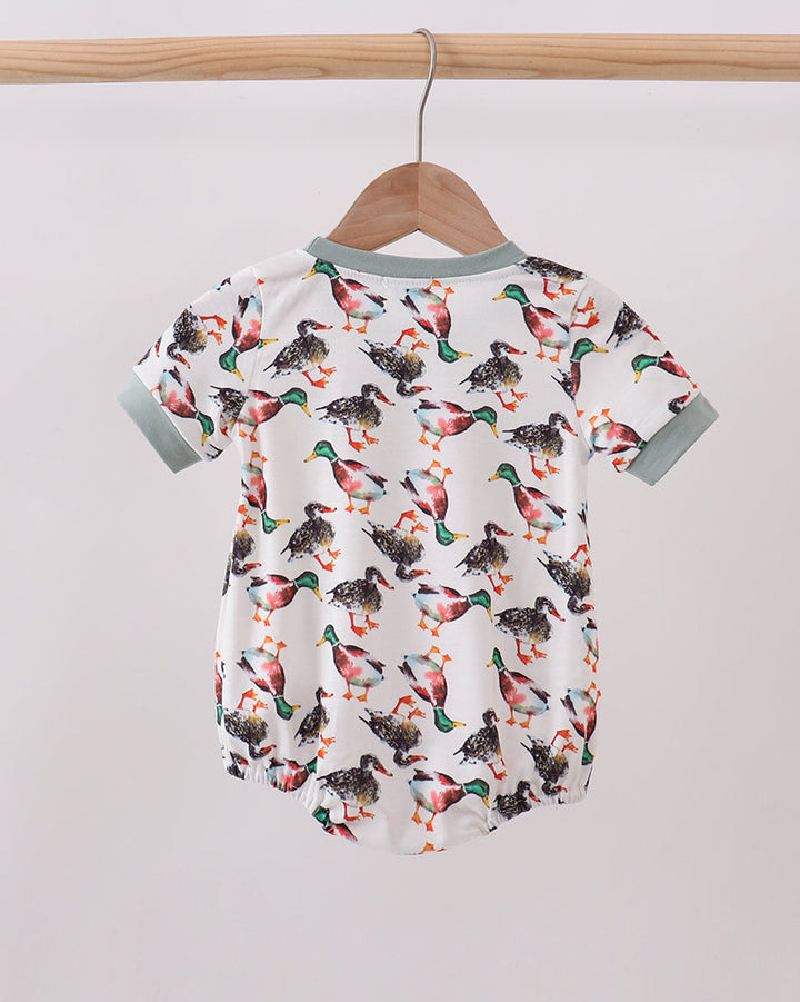 White baby bubble romper with colorful bird pattern, sage collar and short sleeves