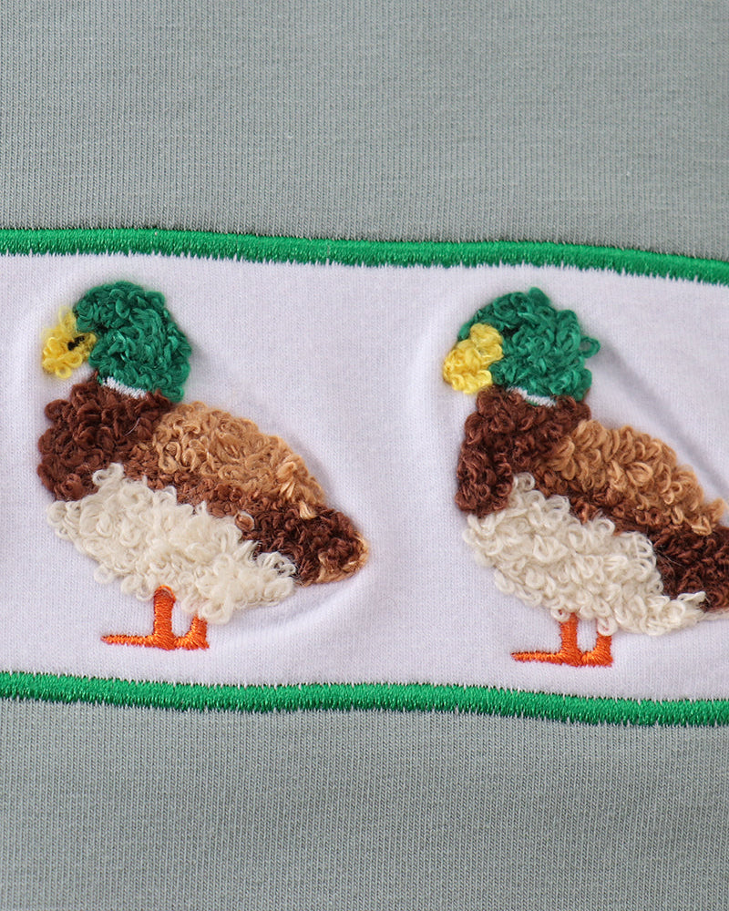 Duck applique detail on duck-print shorts hem