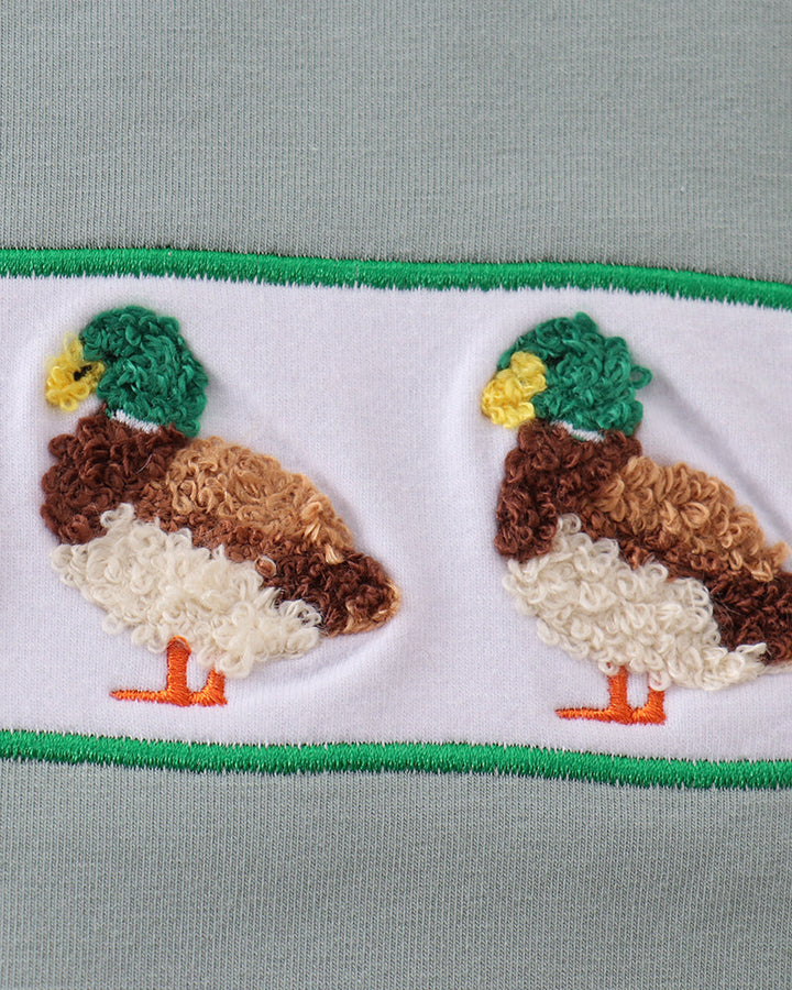 Duck applique detail on duck-print shorts hem