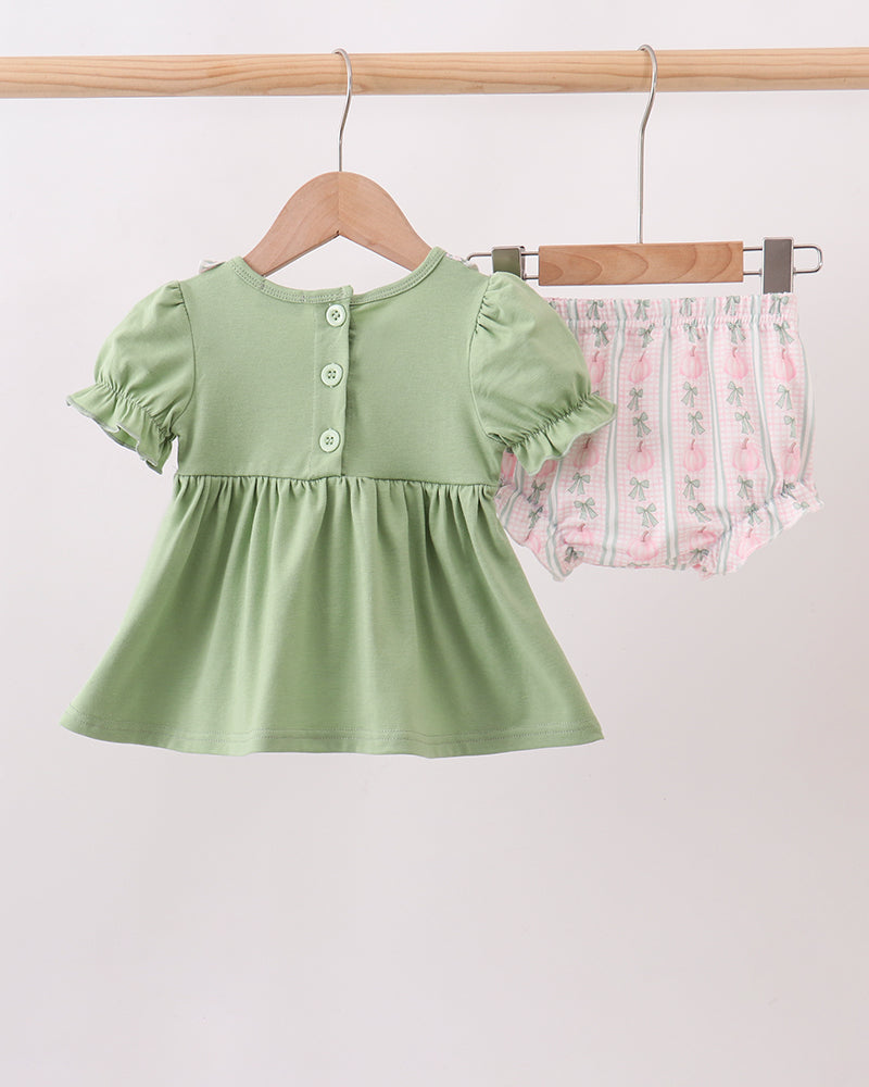 Sage green baby dress with snap button placket and gathered skirt, plus bloomers
