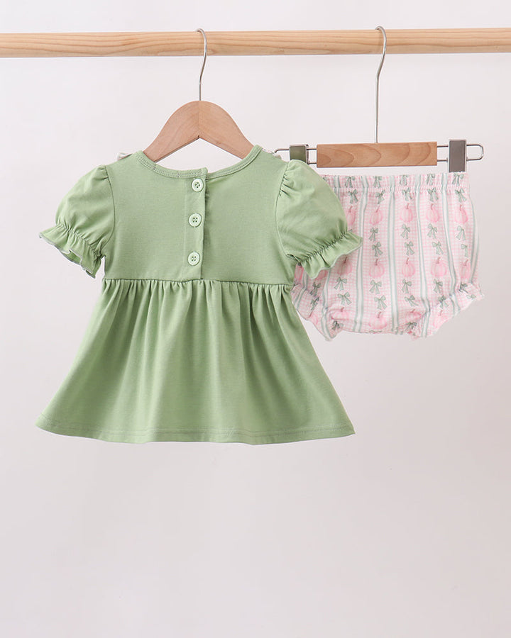 Sage green baby dress with snap button placket and gathered skirt, plus bloomers