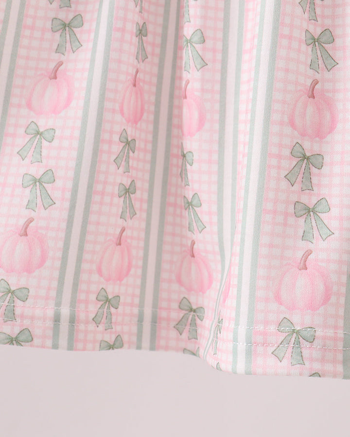 Pink bow-and-pumpkin print skirt with vertical gingham stripes