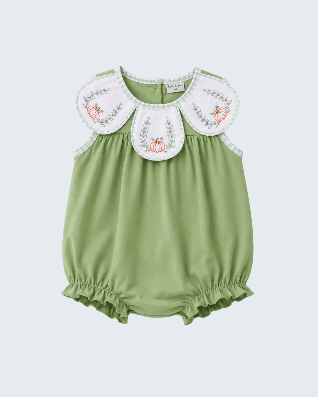 A baby romper in sage green with a white Peter Pan collar featuring embroidered floral details, shown against a light gray background.