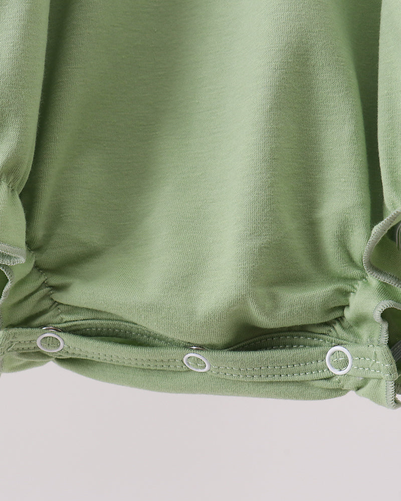 Green romper waistband and elastic leg openings with two snap-button closures