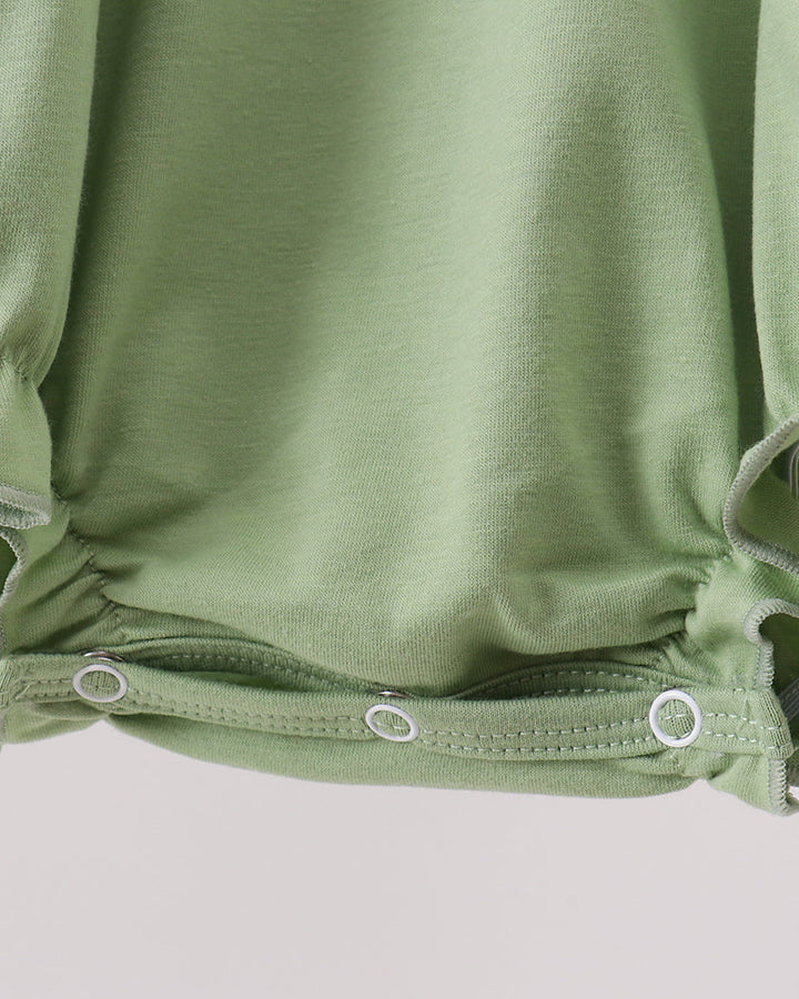 Green romper waistband and elastic leg openings with two snap-button closures