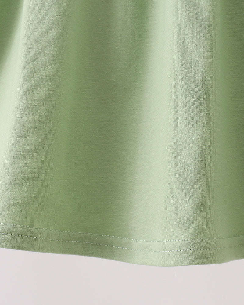 Solid green sleeveless dress with gathered skirt hem