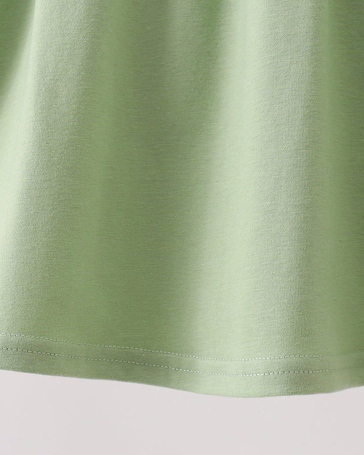 Solid green sleeveless dress with gathered skirt hem