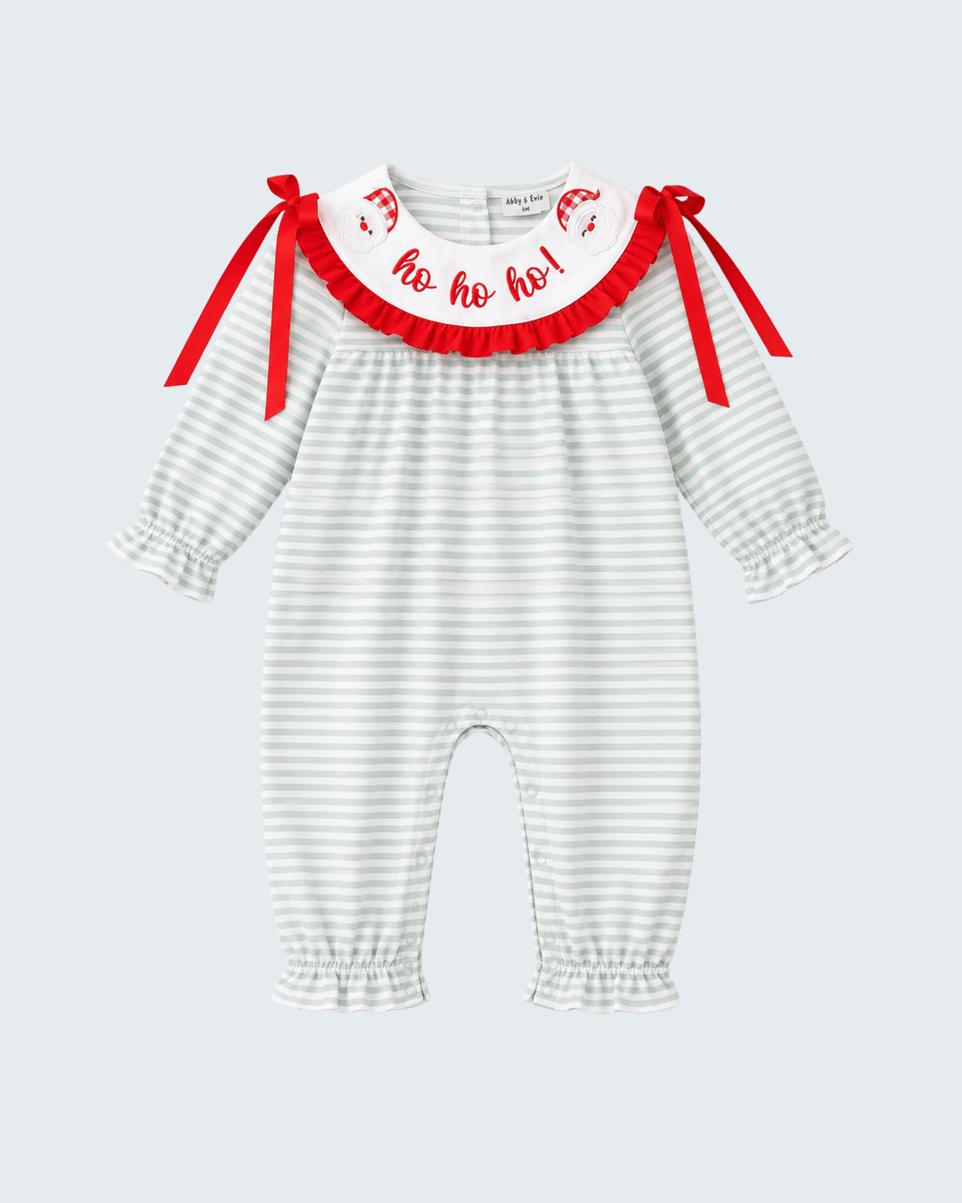 Striped baby romper with red bows, ruffled neckline, and &