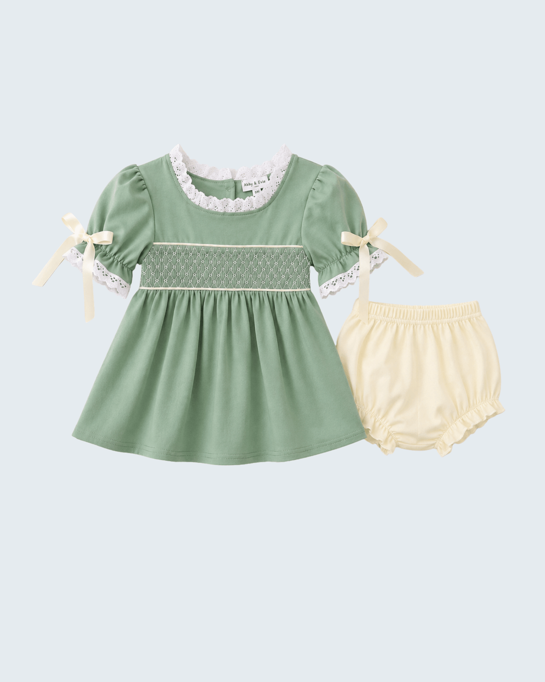 Sage green smocked lace dress with bow sleeves and cream bloomer set