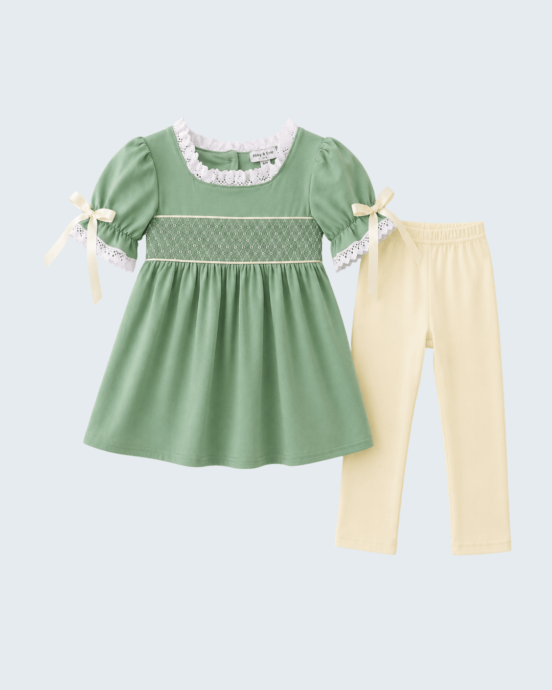 Sage green smocked lace top with bow ties and cream pants, two-piece set