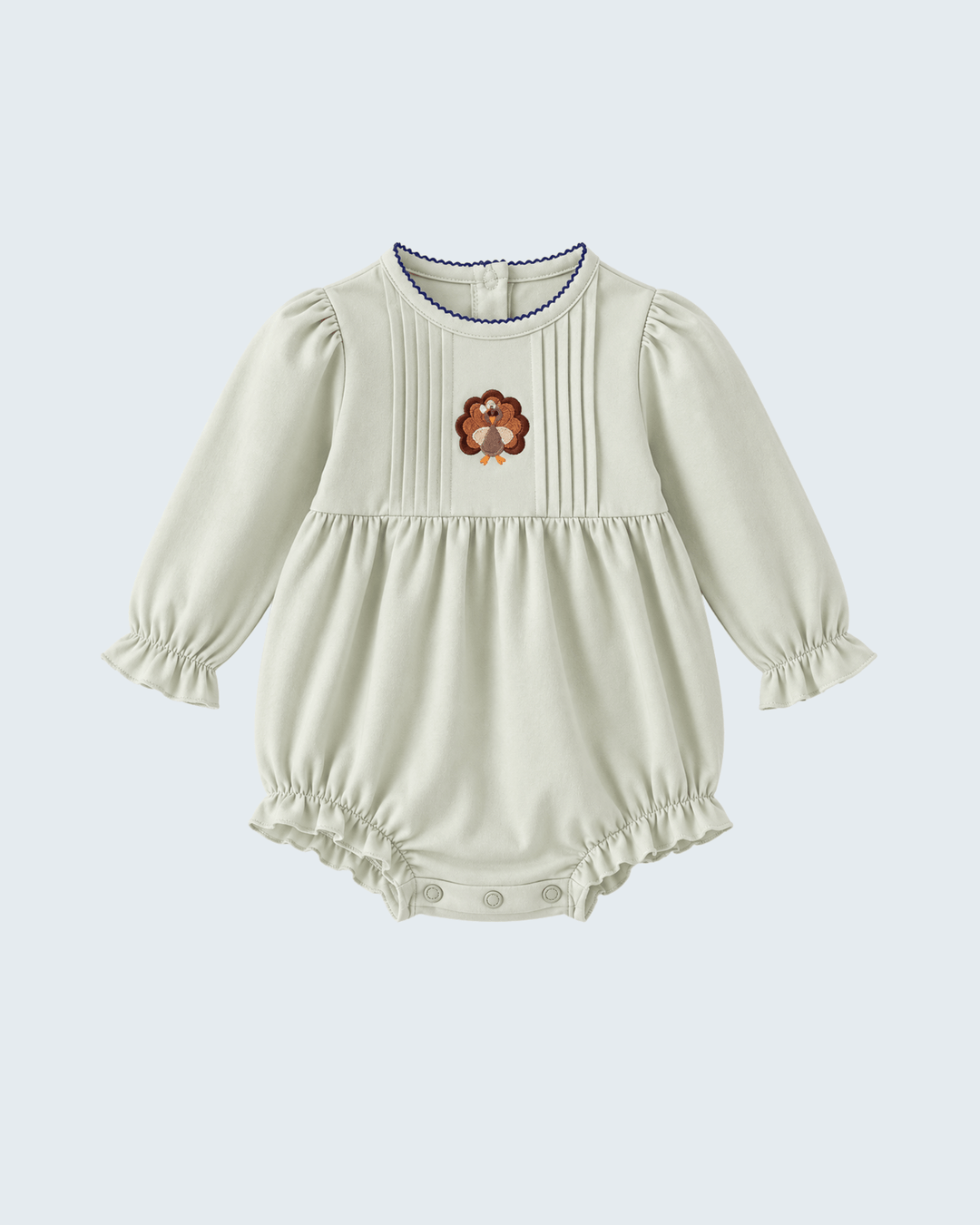 Light sage baby bubble romper with long sleeves, ribbed yoke and turkey embroidery, snap legs